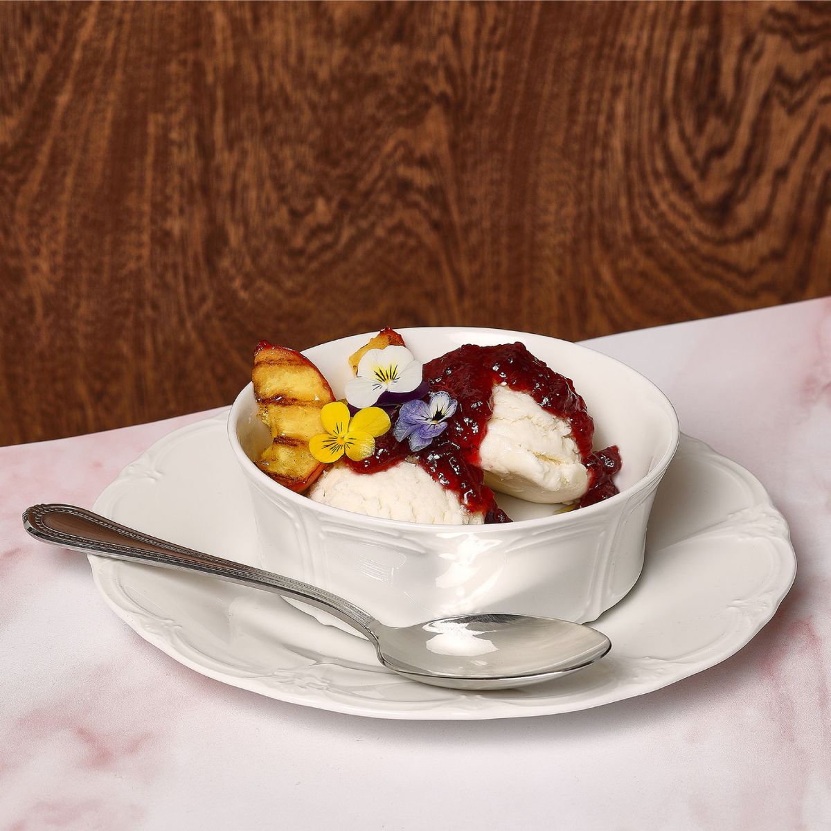 Porcelain plate Retro 21.5 cm with meal, placed on wooden table in atmospheric dining setting.