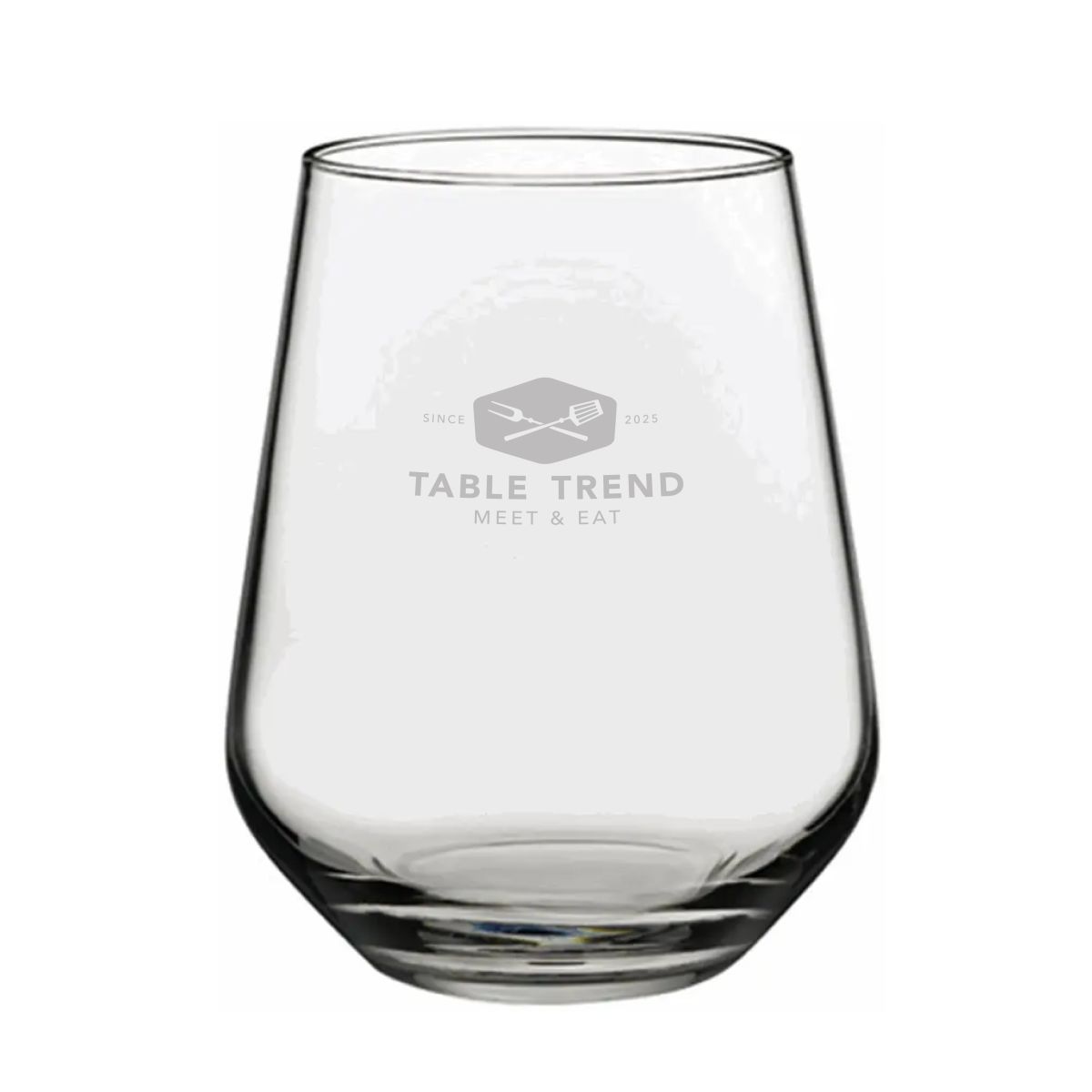 Tumbler glass of 34.5 cl. with fine glass engraving of TableTrend placed on the front.