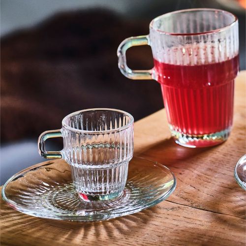 Glass Barshine espresso saucer measuring 14 cm, placed in an atmospheric setting.