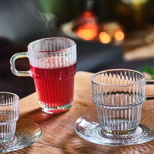 Barshine Tumbler glass 31 cl. glass filled and placed in an atmospheric use setting.