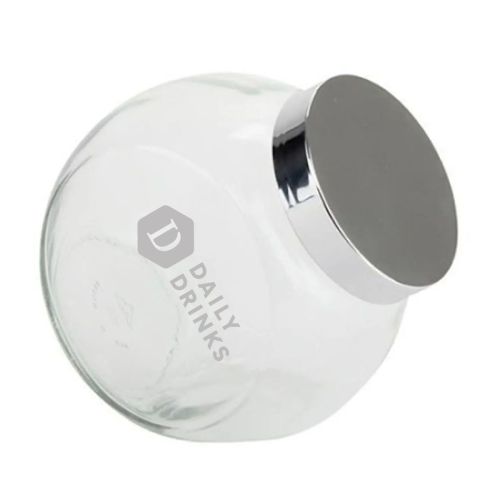 Front view of glass candy jar with silver lid and finely engraved DailyDrinks logo on the surface. Front view of glass candy jar with silver lid and finely engraved DailyDrinks logo on the surface.