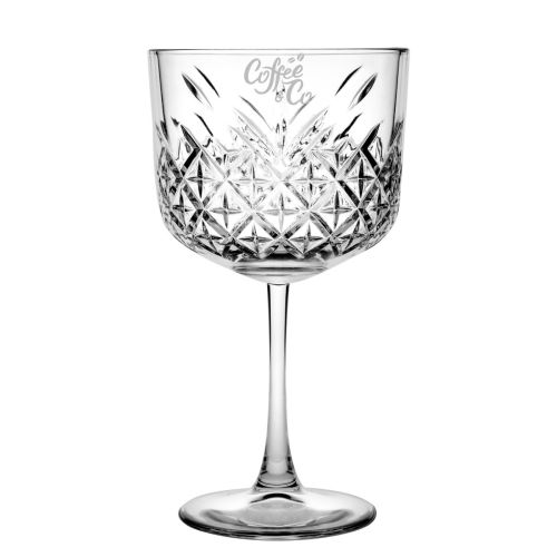 Front of gin-tonic glass with engraved CoffeeCo logo, subtly set in clear glass.