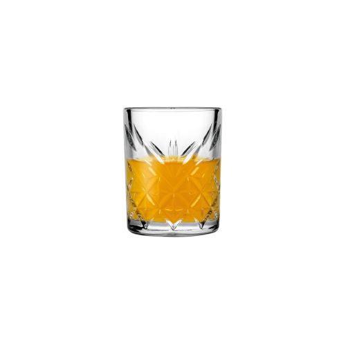 Filled Timeless Shot glass 6 cl. against white background with visible liquid content. Filled Timeless Shot glass 6 cl. against white background with visible liquid content.