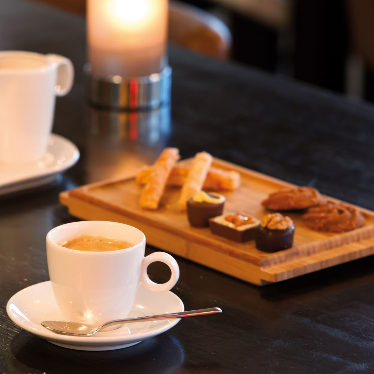 Bart Espresso porcelain 6.5 cl. filled with coffee, presented in atmospheric setting.