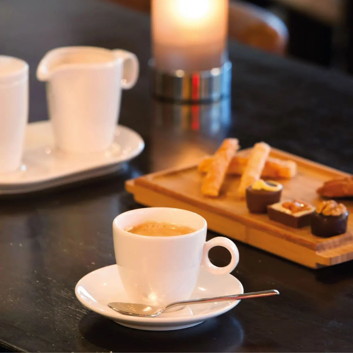 Bart Espresso cup porcelain filled with coffee atmospherically placed in interior setting.