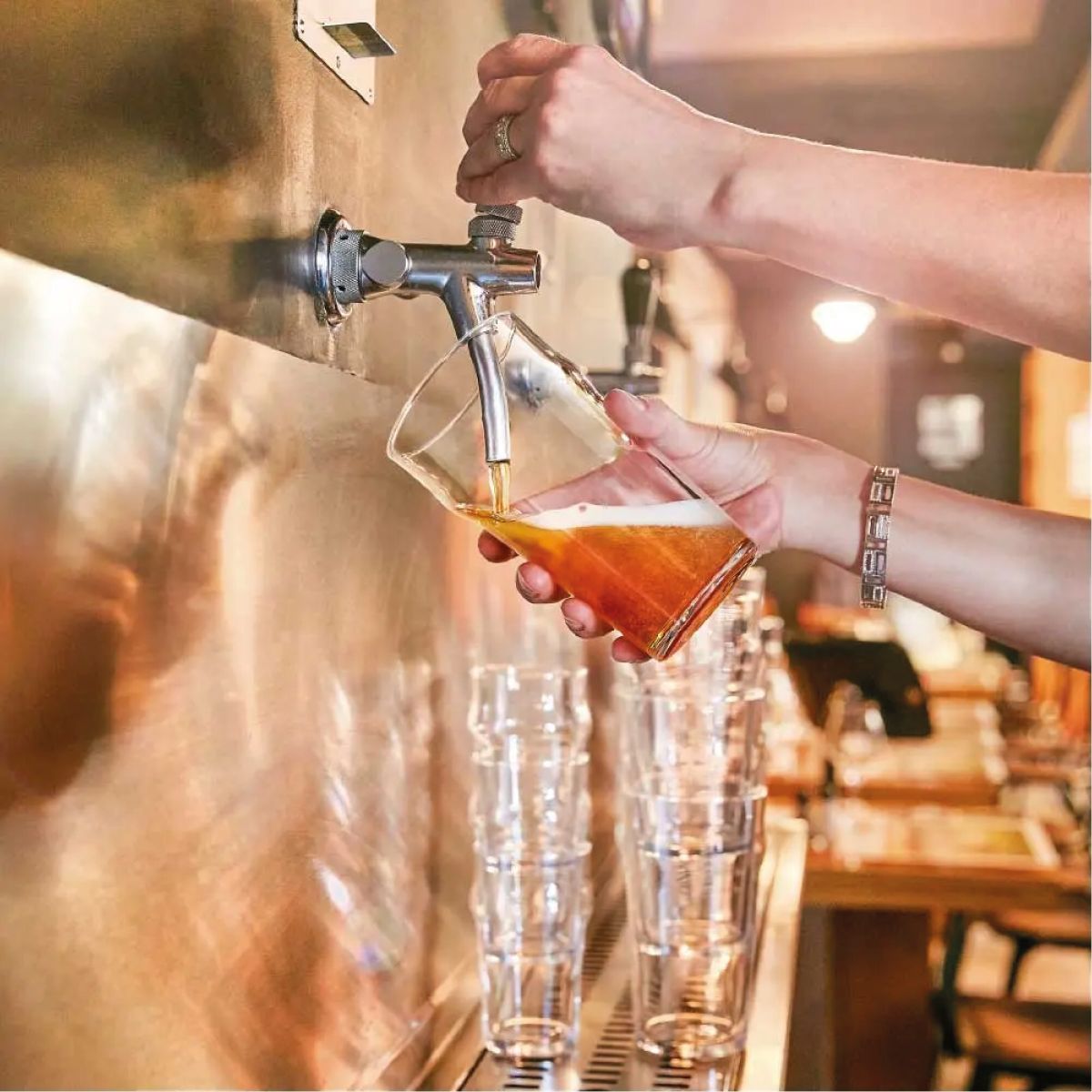 Beer glass with filling in an atmospheric setting.