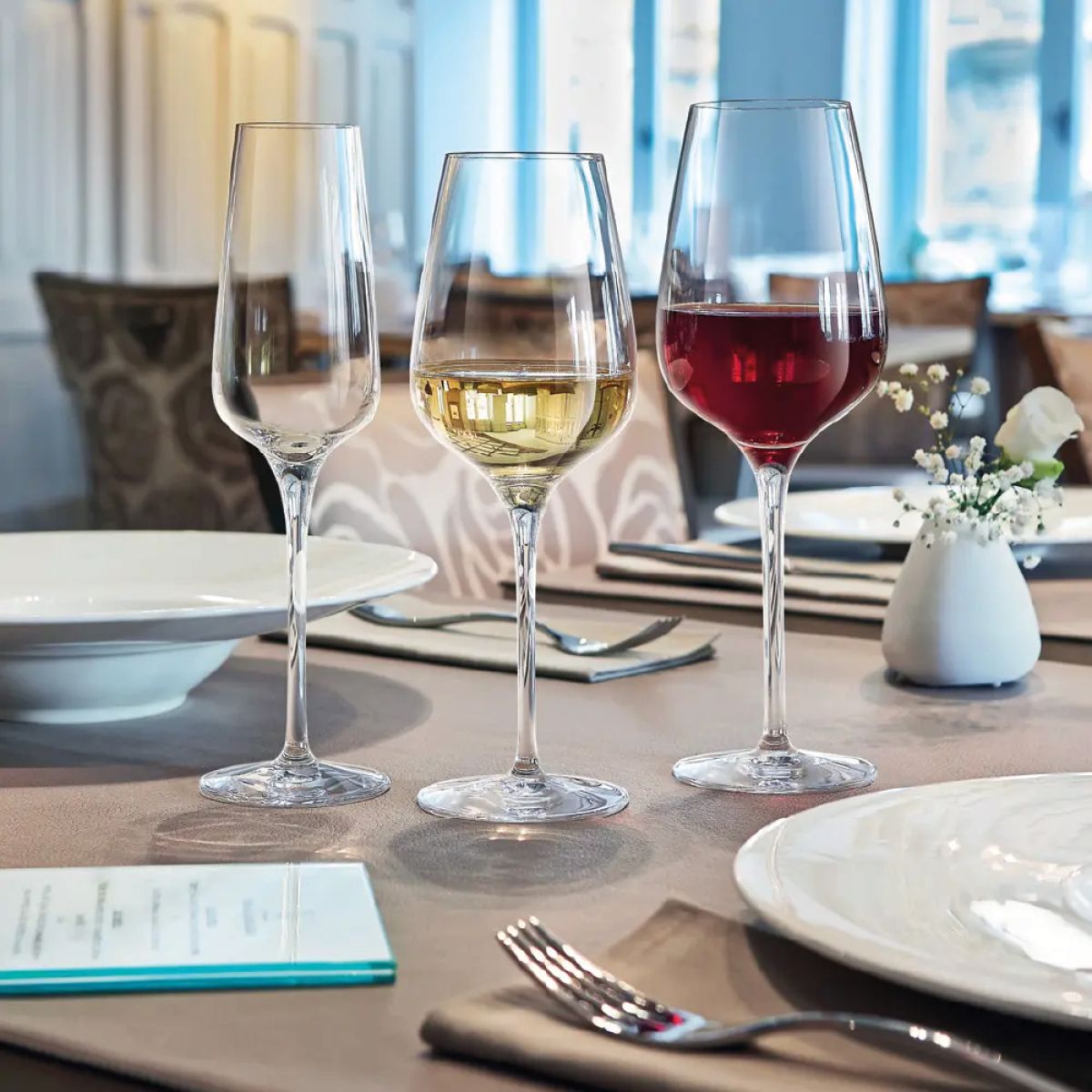 Sublym wine glass 35 cl. filled with wine, presented in atmospheric space.