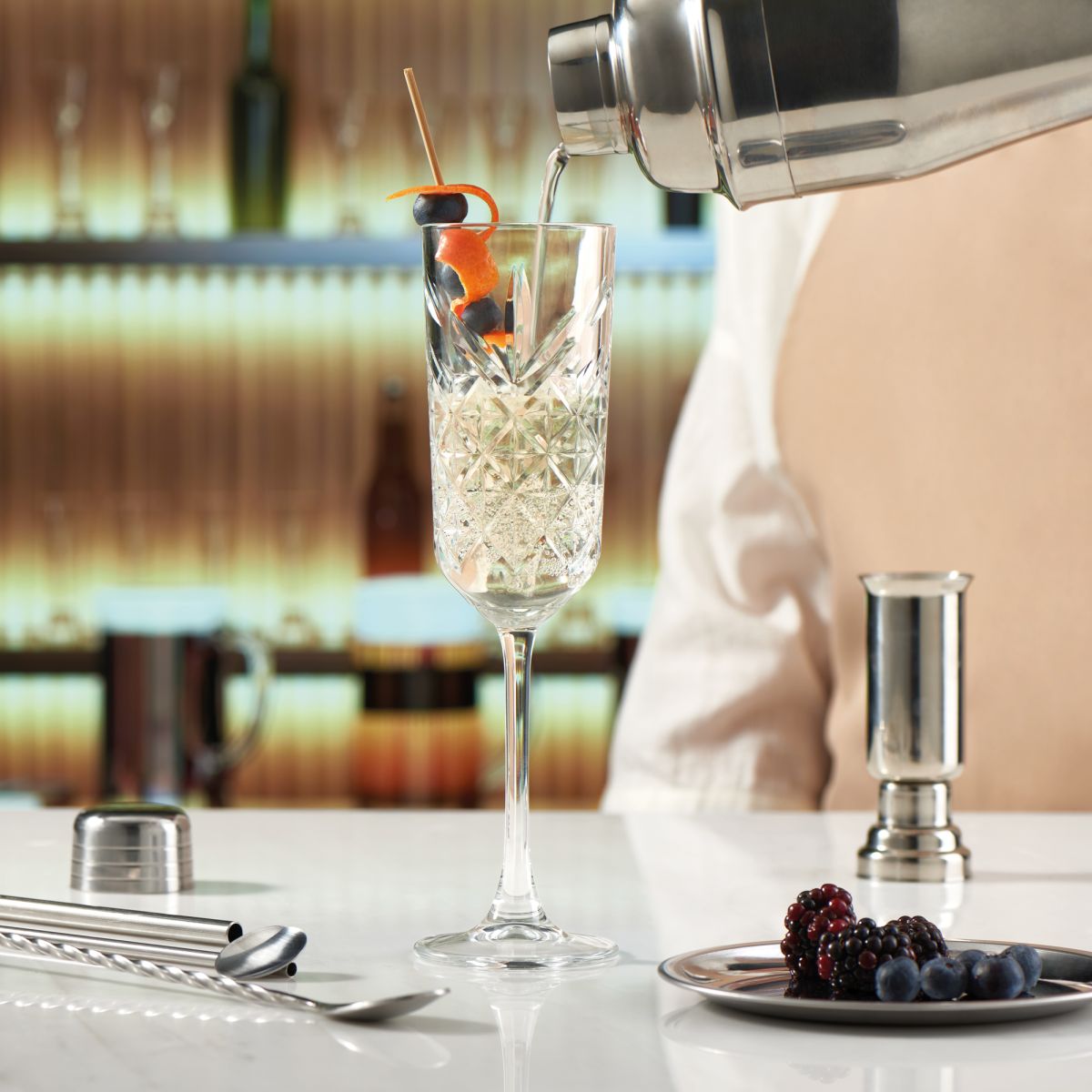 Filled Timeless champagne flute 17.5 cl. during use in an atmospheric setting, suitable for festive drinks.