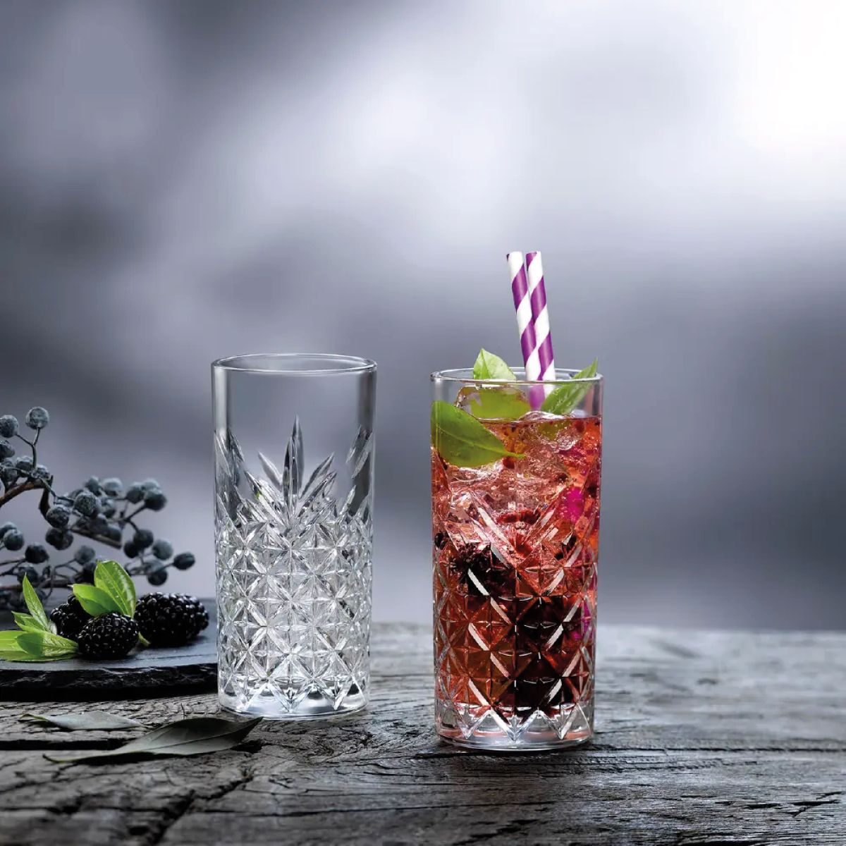 Filled Timeless Longdrink glass, attractively presented in interior with drinks.