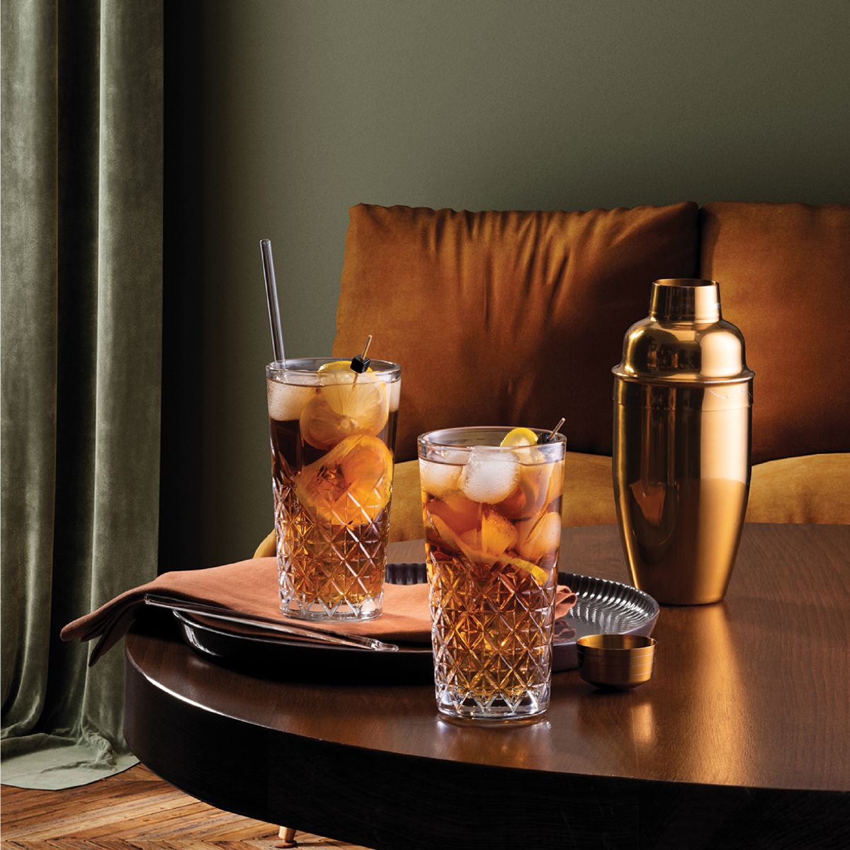 Filled Timeless Longdrink glass 45 cl. attractively presented in modern space.