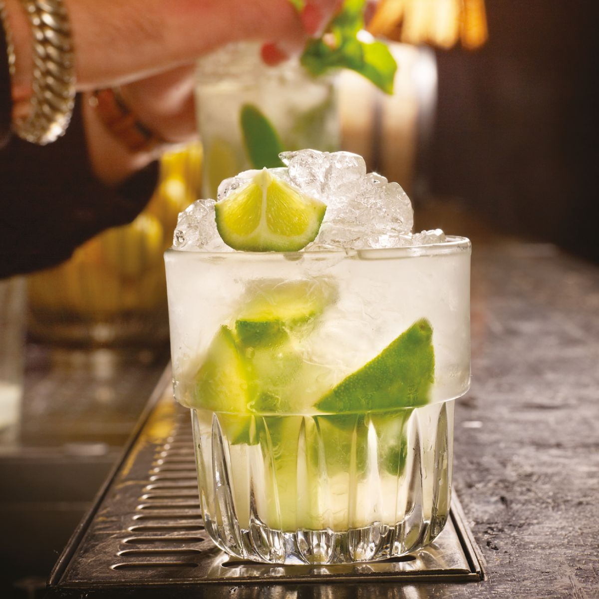 Filled Tumbler Onis Everest 26.5 cl glass in attractive interior setting.