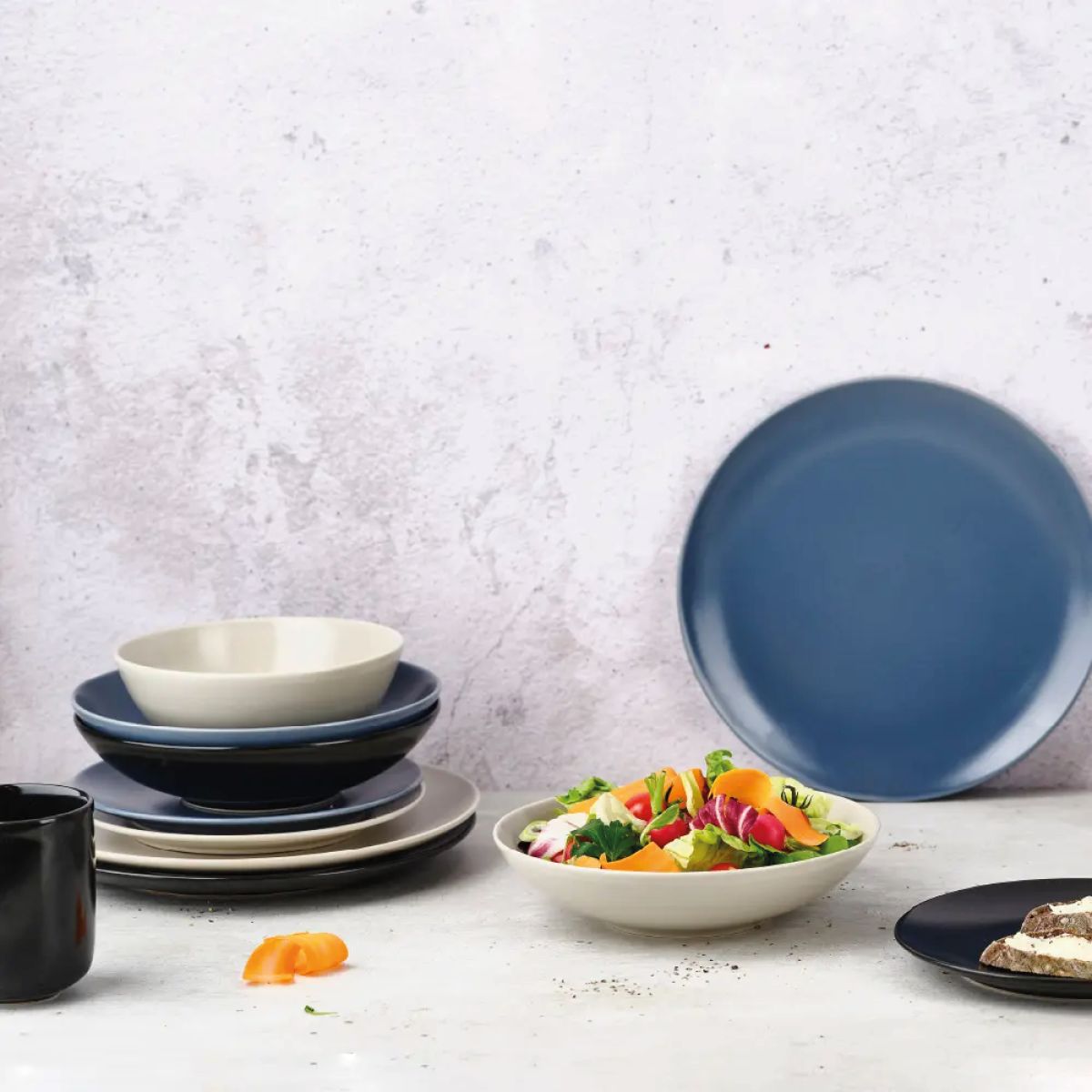 Filled Venus bowl with visible logo placed in an atmospheric setting on plain background.